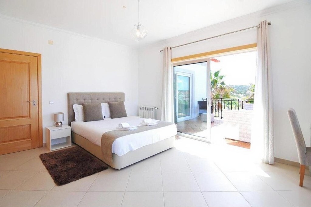 Bedroom 1: double bed and terrace access