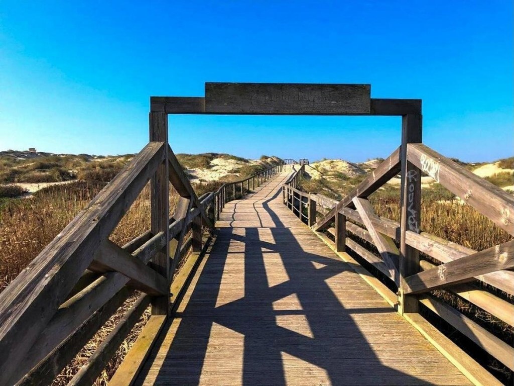 The wooden boardwalk to the beach